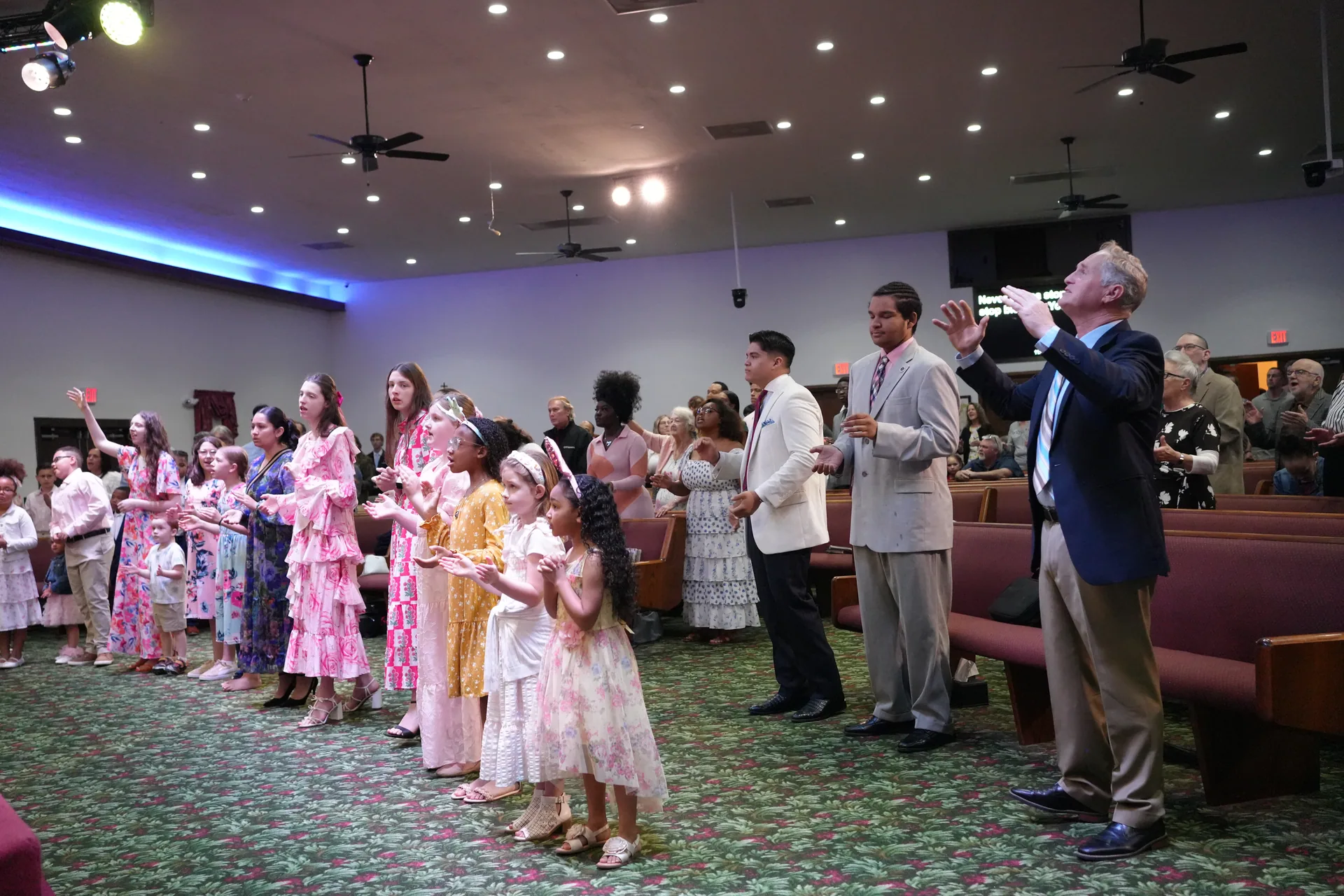 The congregation at Bethel standing together during a Sunday service